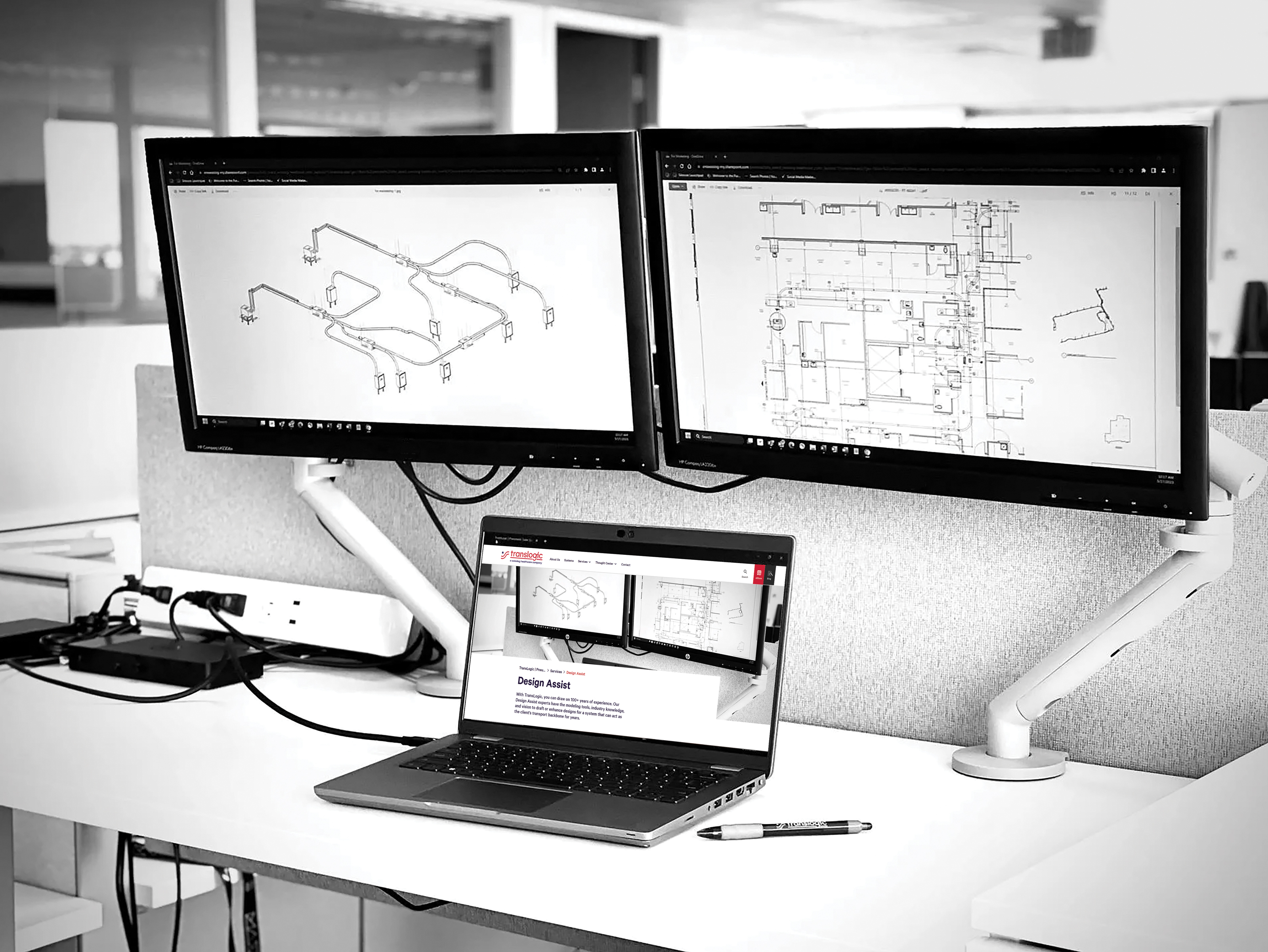two computers showing bim 3d model and design plans