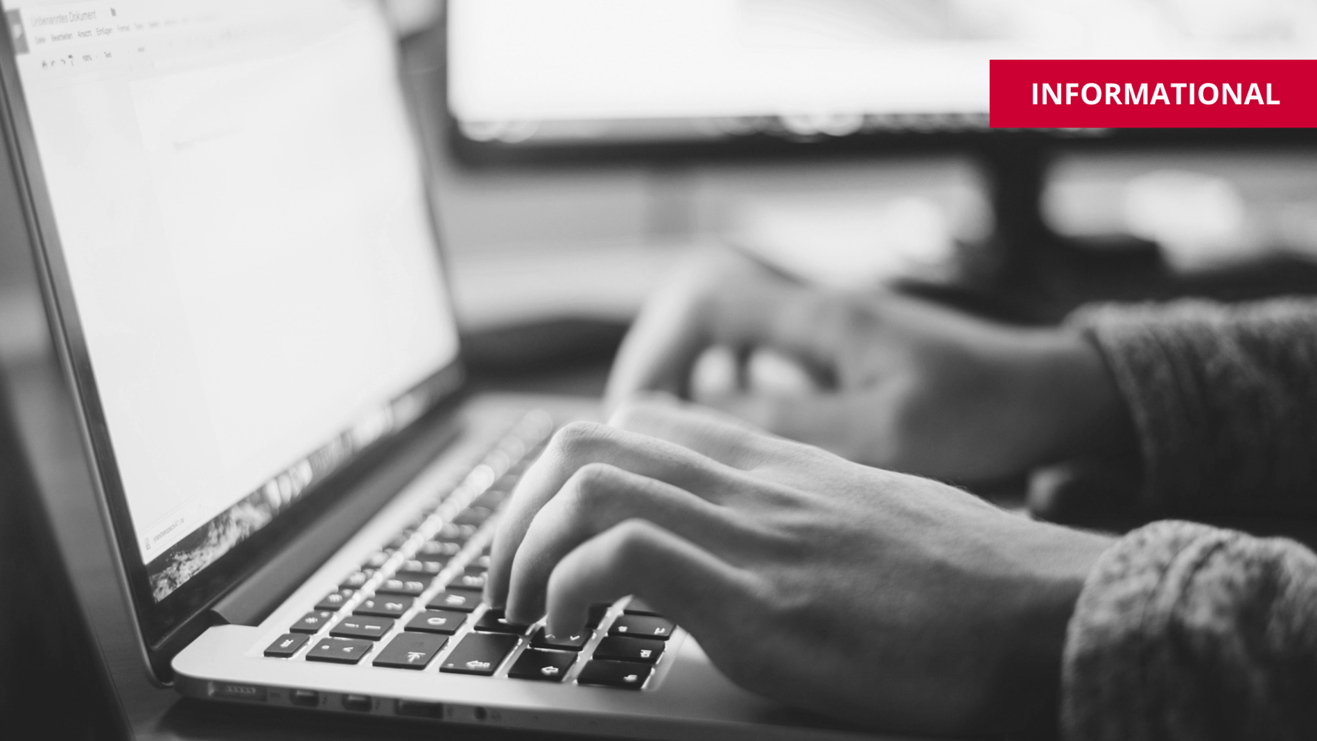 hands typing rfp at computer