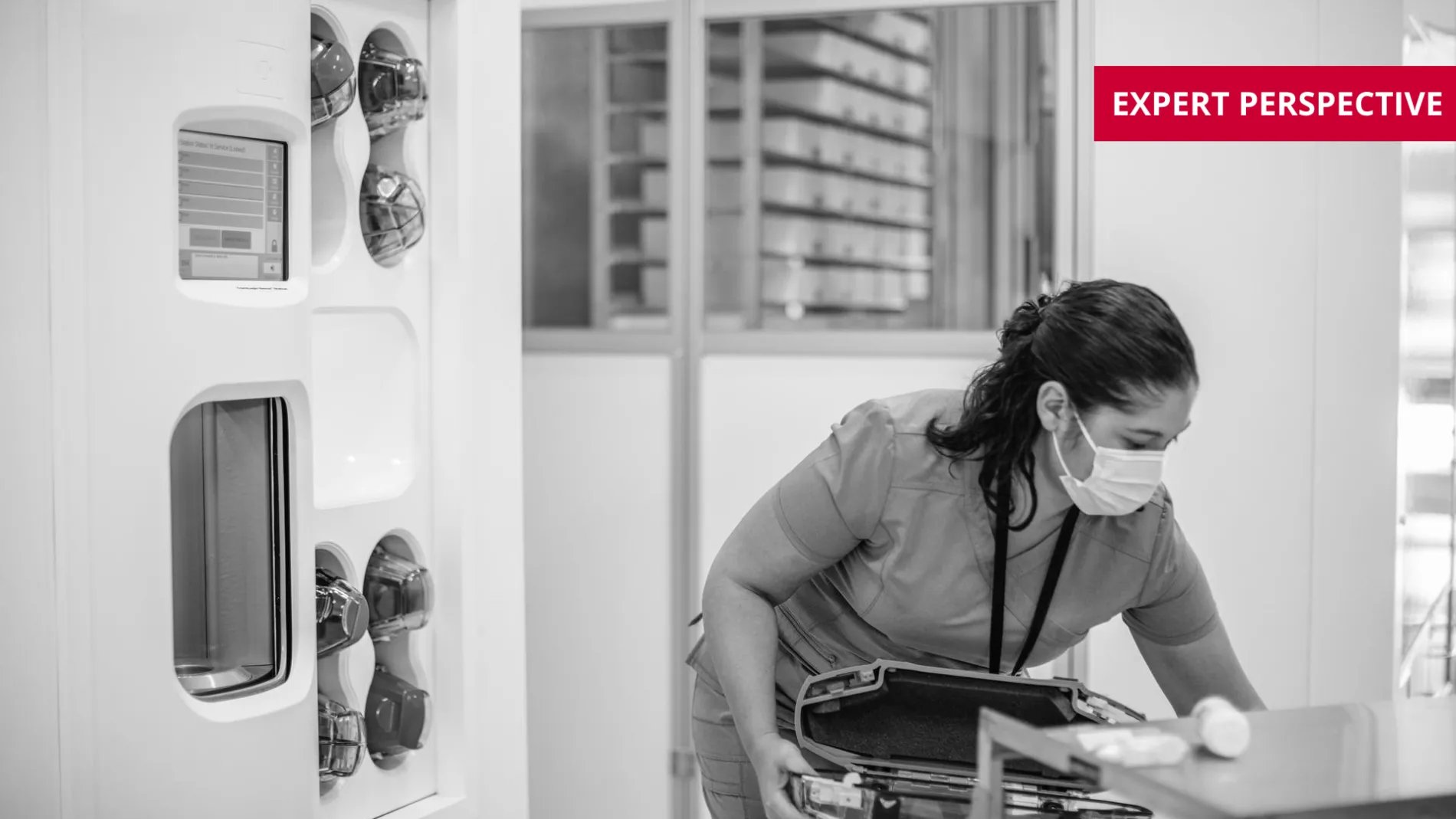 hospital staff loading pneumatic tube system carrier