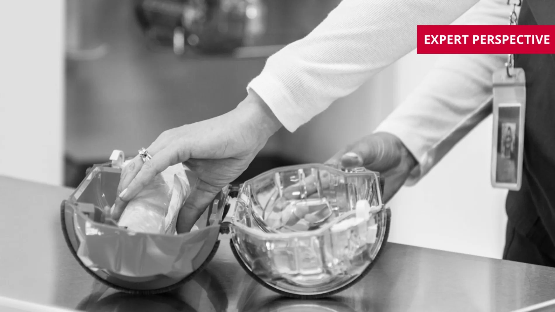 staff loading a tube system carrier with medication