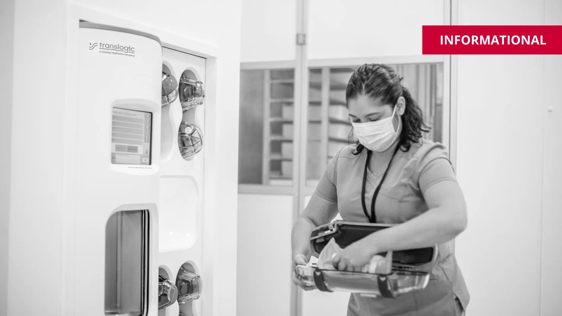 Hospital staff putting contents into pneumatic tube system carrier