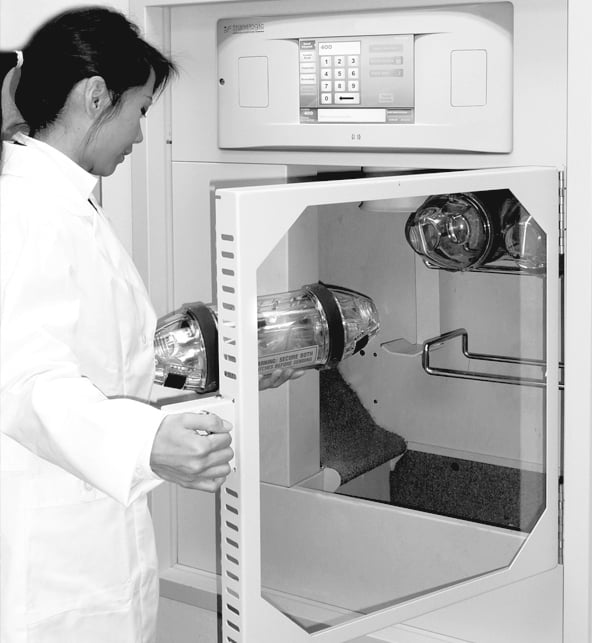 Pharmacist opening TransLogic station access door 