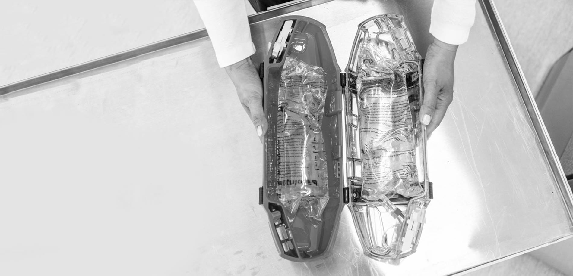 tube system carrier containing two bags of saline