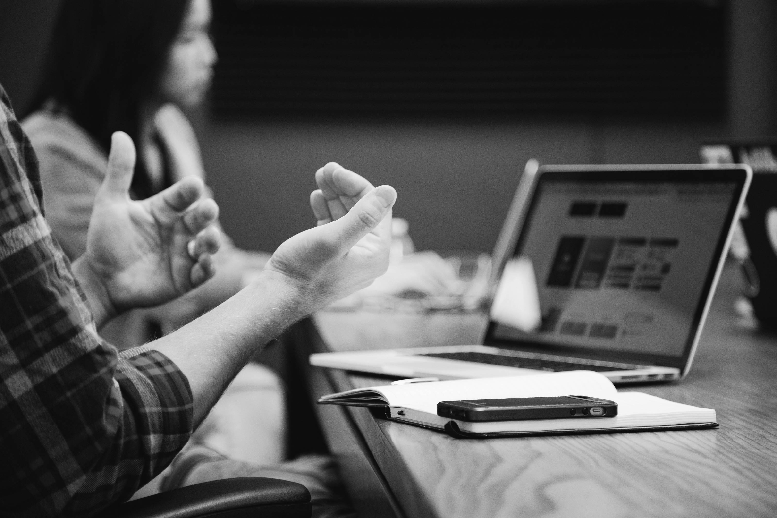man using phone and computer