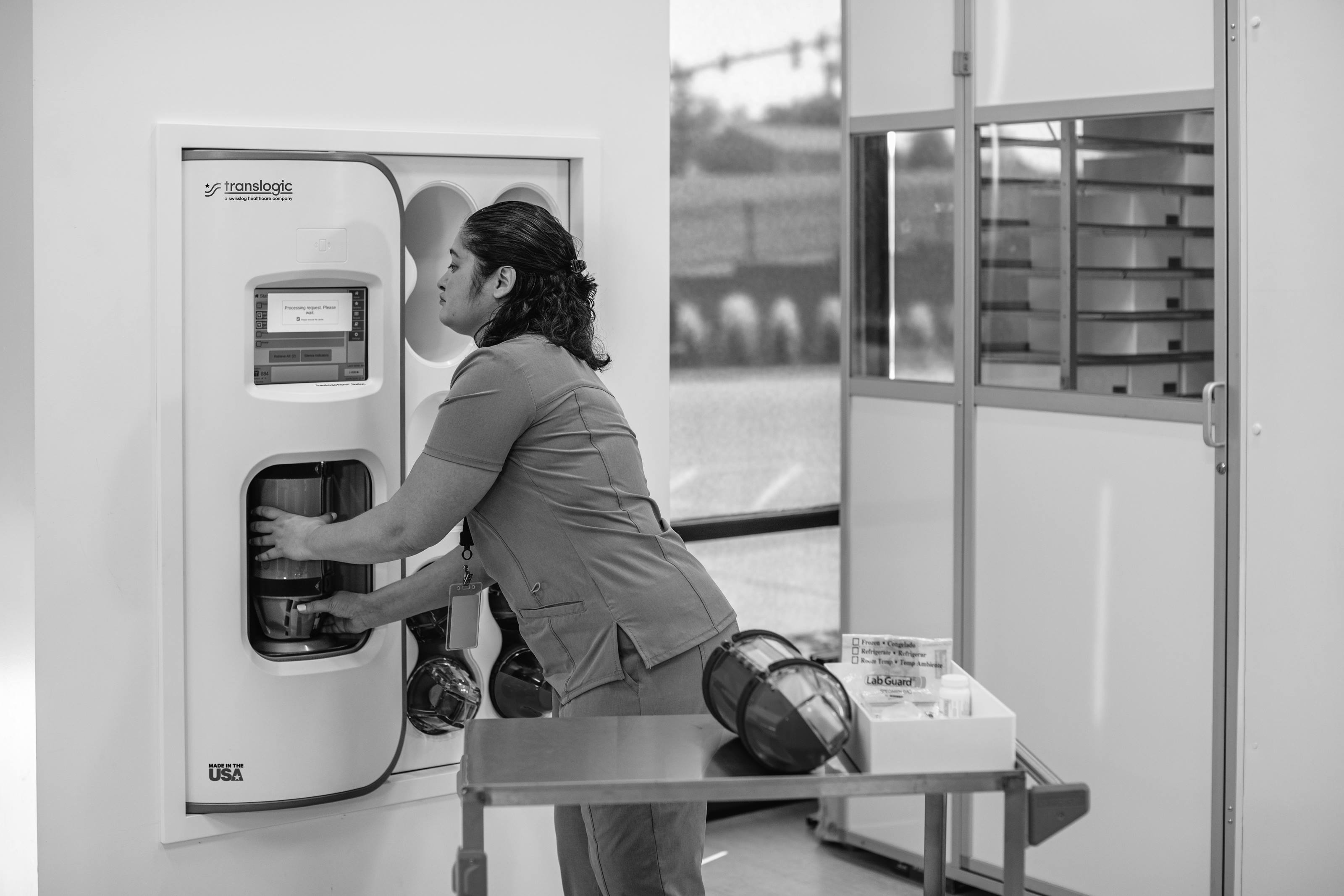 staff loading pneumatic tube system carrier