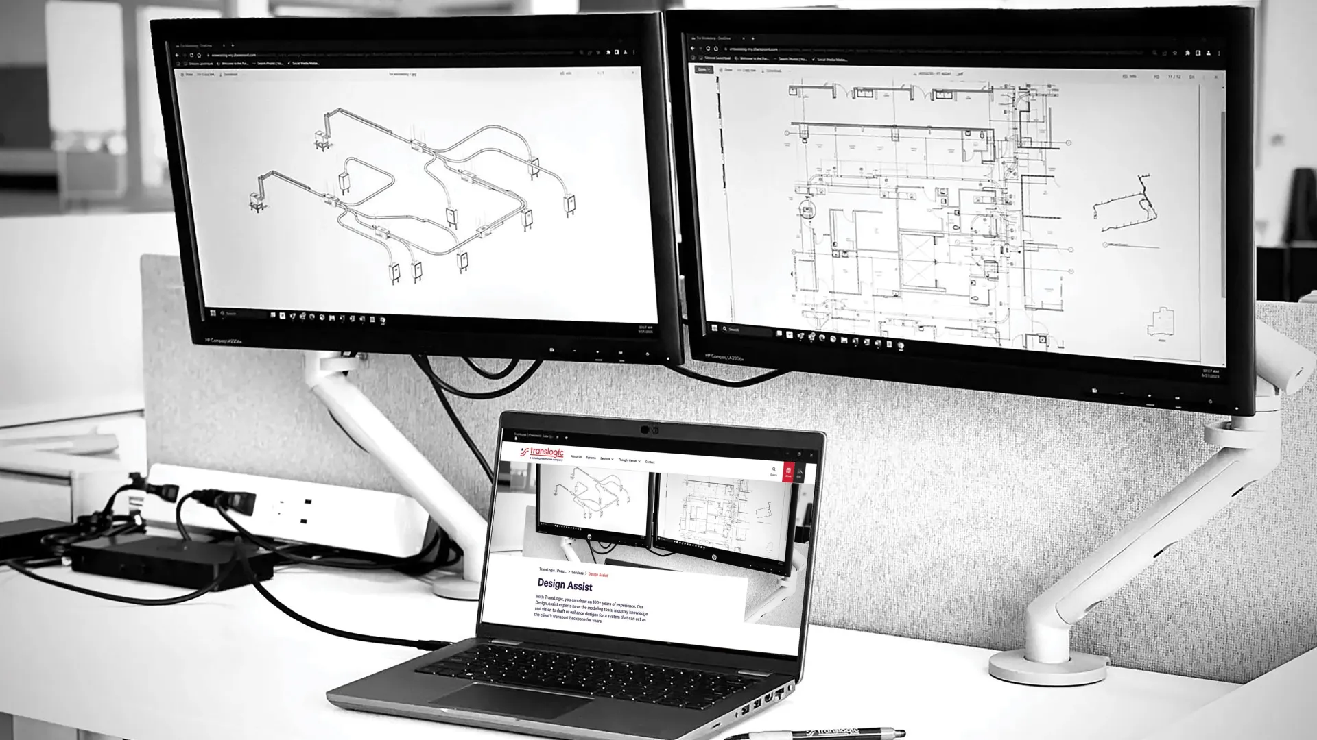 two computers showing bim 3d model and design plans