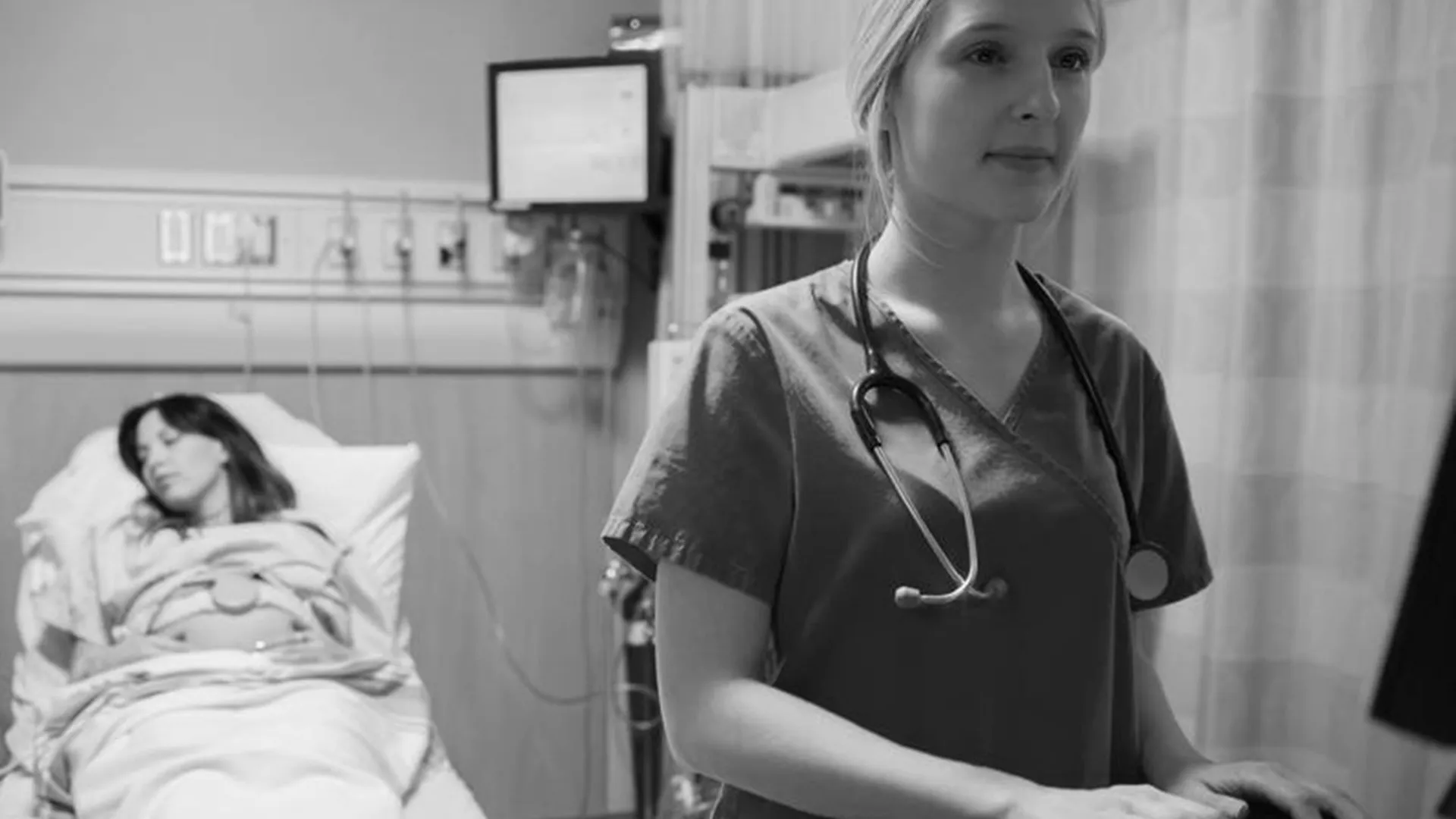 Hospital staff using computer in black and white