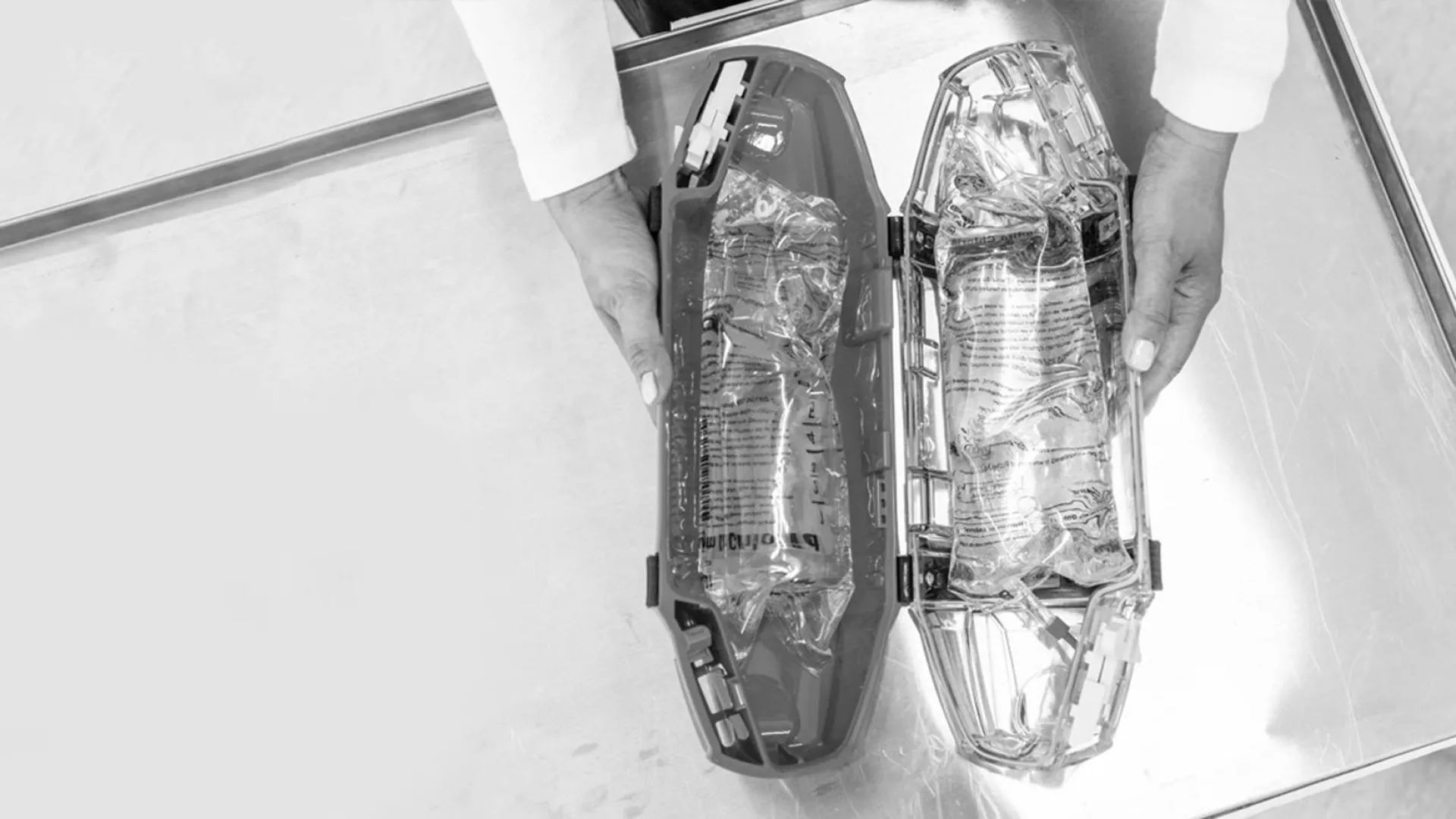 tube system carrier containing two bags of saline